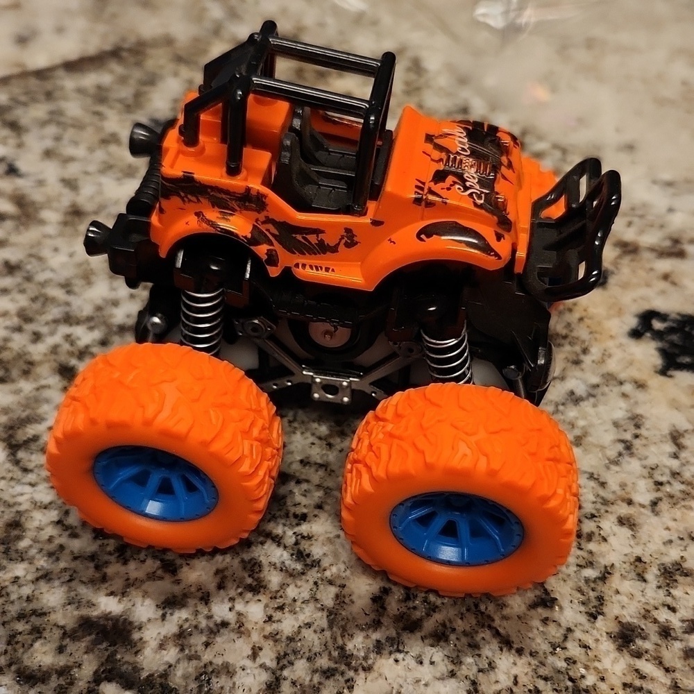 Jeep monster truck reve up car orange black